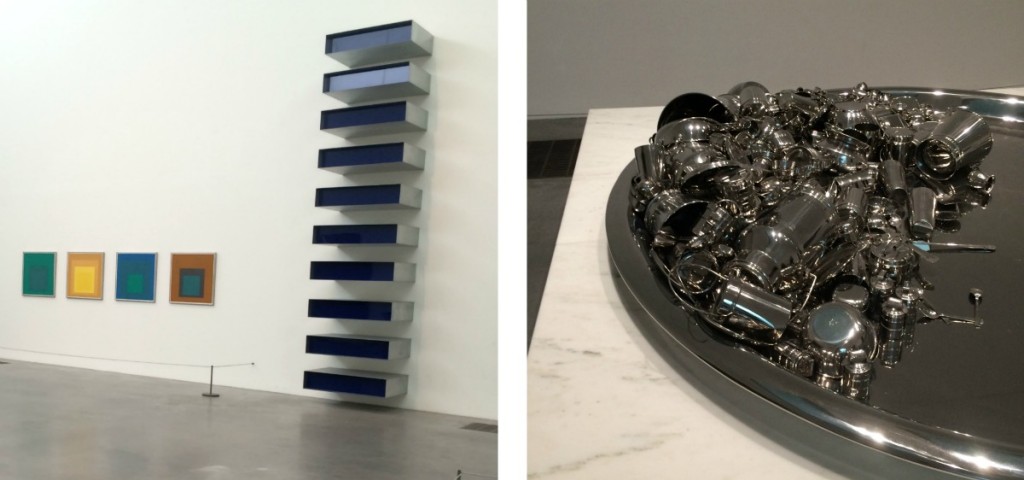 Two artworks: one in a set of large rectangular blocks mounted one above the other mounted likes shelves on a wall. The other is a collection of small objects on a dish, all cast from the same metal.